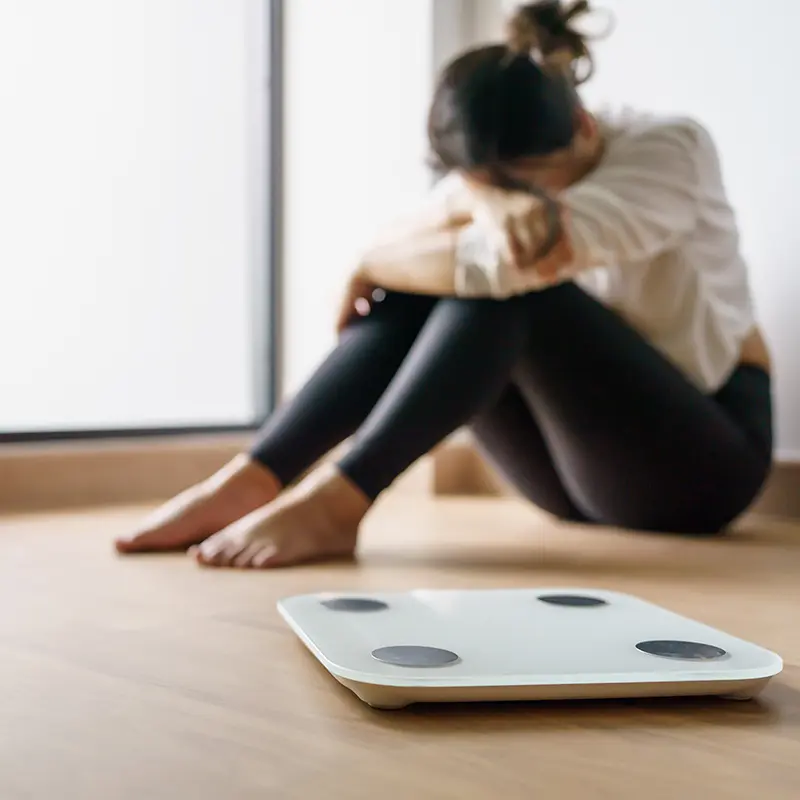 Sad woman, difficulty losing weight